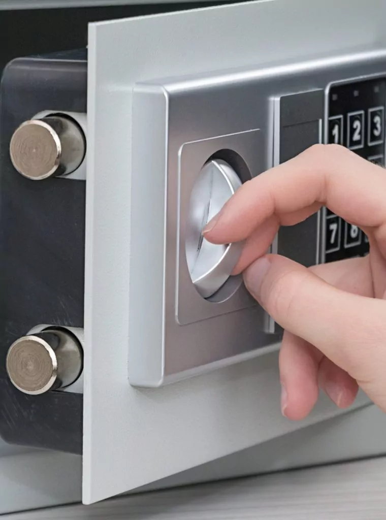female-hand-opens-the-safe-door-with-dollars-and-j-2023-11-27-05-13-42-utc-scaled.jpg